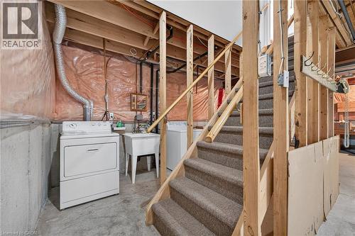 Carpeted staircase with wooden railings and framing - 795 Tenth Avenue, Hamilton, ON 