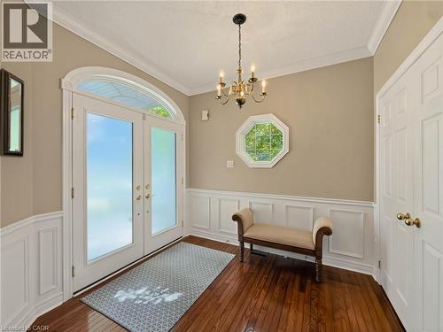 Wood-finish flooring with wainscoting and crown molding - 74 Davidson Boulevard, Dundas, ON 