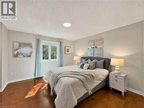 Hardwood flooring, neutral wall tones, recessed ceiling lighting, and a large window - 74 Davidson Boulevard, Dundas, ON 