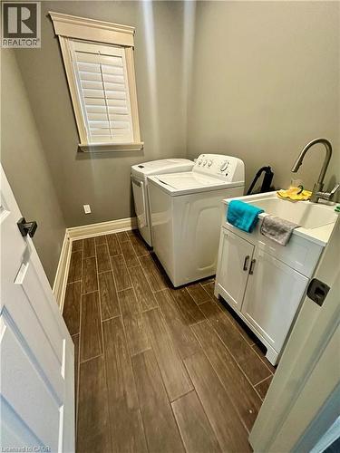 Wood-finish tile flooring throughout - 5 Arden Avenue, Hamilton, ON 