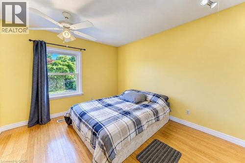 Hardwood flooring, white window frame, ceiling fan, track lighting, and white trim - 34 Wayne Drive, Kitchener, ON 