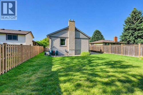Expansive grass lawn with a full privacy fence - 34 Wayne Drive, Kitchener, ON 