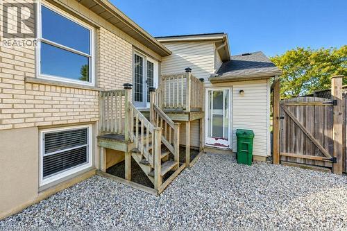 Gate to rear yard with garage access and future patio - 34 Wayne Drive, Kitchener, ON 