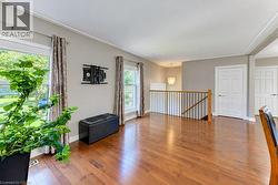 Gleaming hardwood floors in spacious open concept kitchen and living room - 