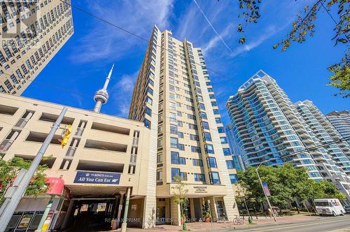 Building with entrance to parking area on left. - 301 - 250 Queens Quay W, Toronto, ON 