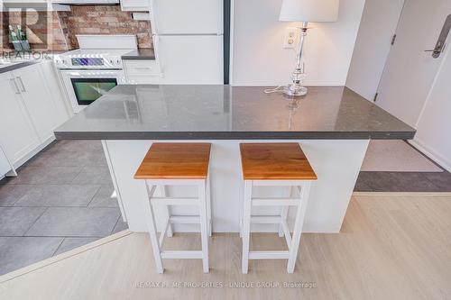 Breakfast bar with quartz counters. - 301 - 250 Queens Quay W, Toronto, ON 