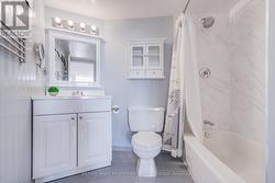 4 piece bathroom with attached mirror. - 