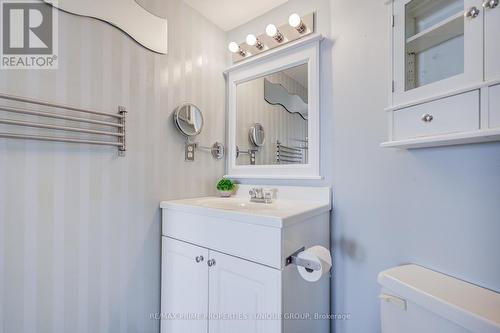 Bathroom with attached towel rack and mirror. - 301 - 250 Queens Quay W, Toronto, ON 