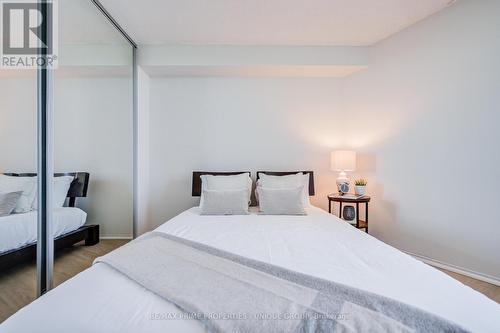 Bedroom with mirrored closet door. - 301 - 250 Queens Quay W, Toronto, ON 