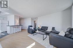Living room with view towards breakfast counter. - 