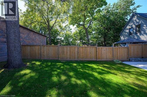 Expansive lawn with a full privacy fence and mature trees - 4 Albemarle Street, Hamilton, ON 