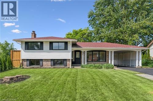 Split-level residence featuring white siding and a brick foundation - 299 Dale Crescent, Waterloo, ON 