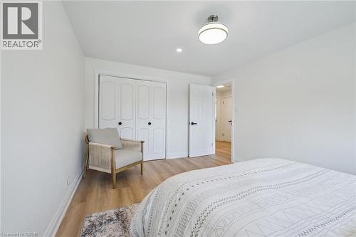 Bright interior featuring light wood-finish flooring and white walls - 299 Dale Crescent, Waterloo, ON 