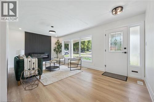 Light wood-finish flooring throughout the space - 299 Dale Crescent, Waterloo, ON 
