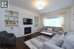 Built-in shelving flanking a stone-finish fireplace - 
