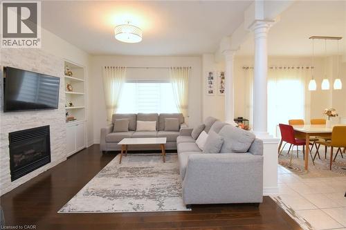White stacked stone fireplace with built-in shelving - 25 Guest Street, Hamilton, ON 