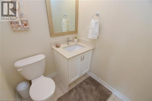 Vanity with integrated sink, light-toned countertop, and chrome faucet - 25 Guest Street, Hamilton, ON 