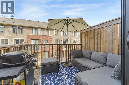 Private outdoor deck with wood railing - 1890 Rymal Road E Unit# 144, Hamilton, ON 