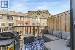 Private outdoor deck with wood railing - 