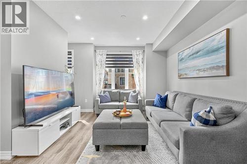 Recessed ceiling lighting, wood-finish flooring, and light gray wall paint - 1890 Rymal Road E Unit# 144, Hamilton, ON 