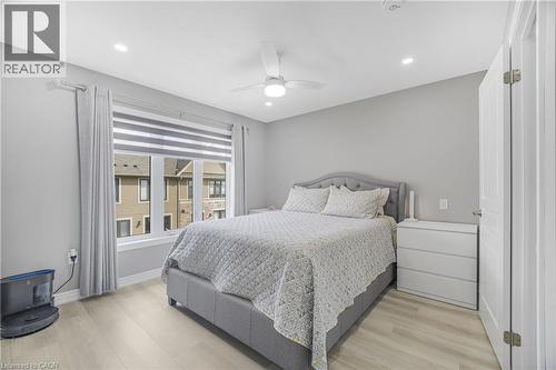 Recessed lighting, ceiling fan, wood-finish flooring, and a window with blinds - 1890 Rymal Road E Unit# 144, Hamilton, ON 