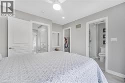 Recessed lighting, ceiling fan with integrated light, a walk-in closet, and a three-piece bathroom with a glass-enclosed shower - 