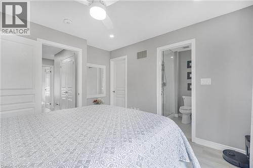 Recessed lighting, ceiling fan, wood-finish flooring, white trim, and a full bathroom with a walk-in shower - 1890 Rymal Road E Unit# 144, Hamilton, ON 