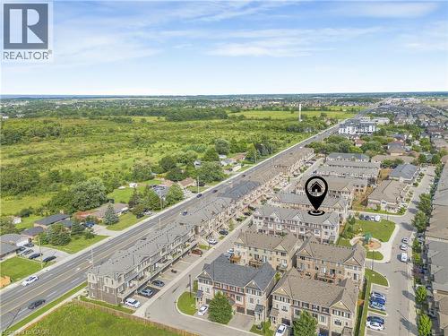 Aerial perspective showcasing a residential community with townhomes and detached properties - 1890 Rymal Road E Unit# 144, Hamilton, ON 