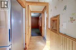 Wood-finish flooring with coordinating wood trim and wainscoting - 