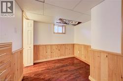 Wood-finish flooring with natural wood paneling - 