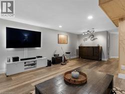 Recessed lighting, wood-finish flooring, and light gray wall paint - 