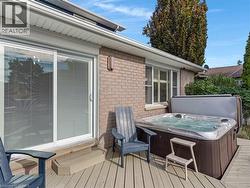 Wood-finish deck with a built-in hot tub - 