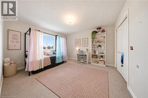 Carpeted room with a ceiling-mounted light fixture - 61 Sunnyside Drive, St. George, ON 