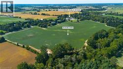 33-acre farm parcel surrounded by agricultural fields and mature trees - 