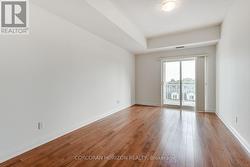 Primary bedroom with walkout to balcony - 