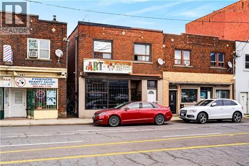Brick exterior with multiple retail storefronts - 689 E Barton Street E, Hamilton, ON 