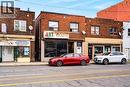 Brick exterior with multiple retail storefronts - 689 E Barton Street E, Hamilton, ON 