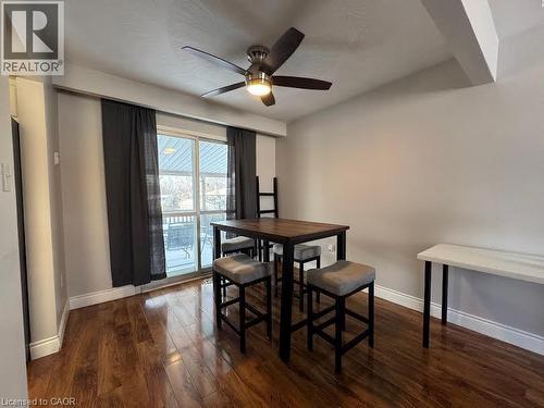Wood-finish flooring, ceiling fan with integrated lighting, sliding glass door, and a built-in shelf - 511 Havelock Drive, Waterloo, ON 