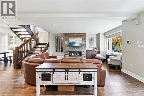 Consistent open-riser solid oak staircase leading from the upstairs straight to the basement - 58 Uplands Avenue, Hamilton, ON 