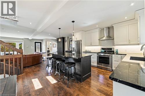 Range hood, white subway tile, extensive drawers in kitchen for ease and better utilization/organization. - 58 Uplands Avenue, Hamilton, ON 
