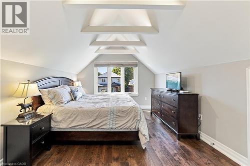 Vaulted ceiling with collar ties and decorative lighting.  Added storage tucked on inside of bedroom walls for maximum utilization of space. - 58 Uplands Avenue, Hamilton, ON 