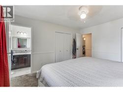 Primary bedroom showing 2-piece ensuite. - 