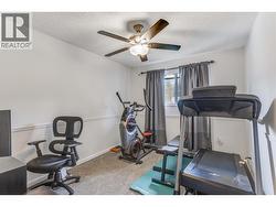 Third bedroom currently used as a home office/gym. - 