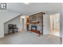 Large family room on the lower level with lots of natural light. - 