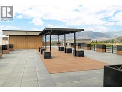 Amenities include a rooftop terrace. - 
