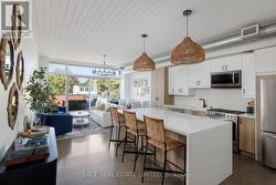 401 - 747 QUEEN STREET E Toronto, ON M4M 1H3