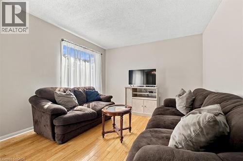 Wood-finish flooring with light-toned walls - 5180 Oakley Drive, Burlington, ON 
