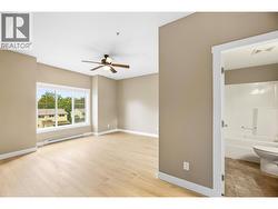 Spacious, king-sized bedroom with an oversized closet featuring mirrored sliding doors, east-facing window - 