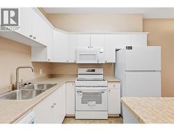 Dual stainless-steel sinks and a butcher-block island - 