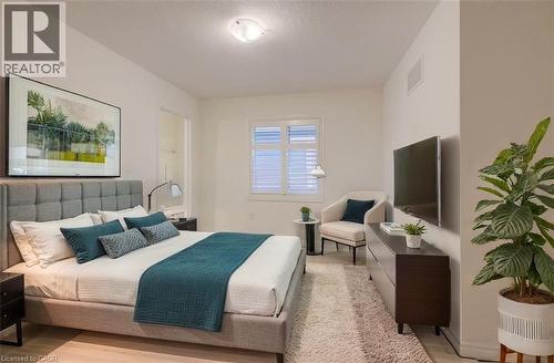 Recessed lighting, wood-finish flooring, white plantation shutters, and an open doorway - 52 Pointer Street, Cambridge, ON 